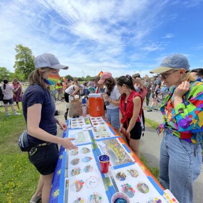 Tabling for Moakley park planning at a Pride event.